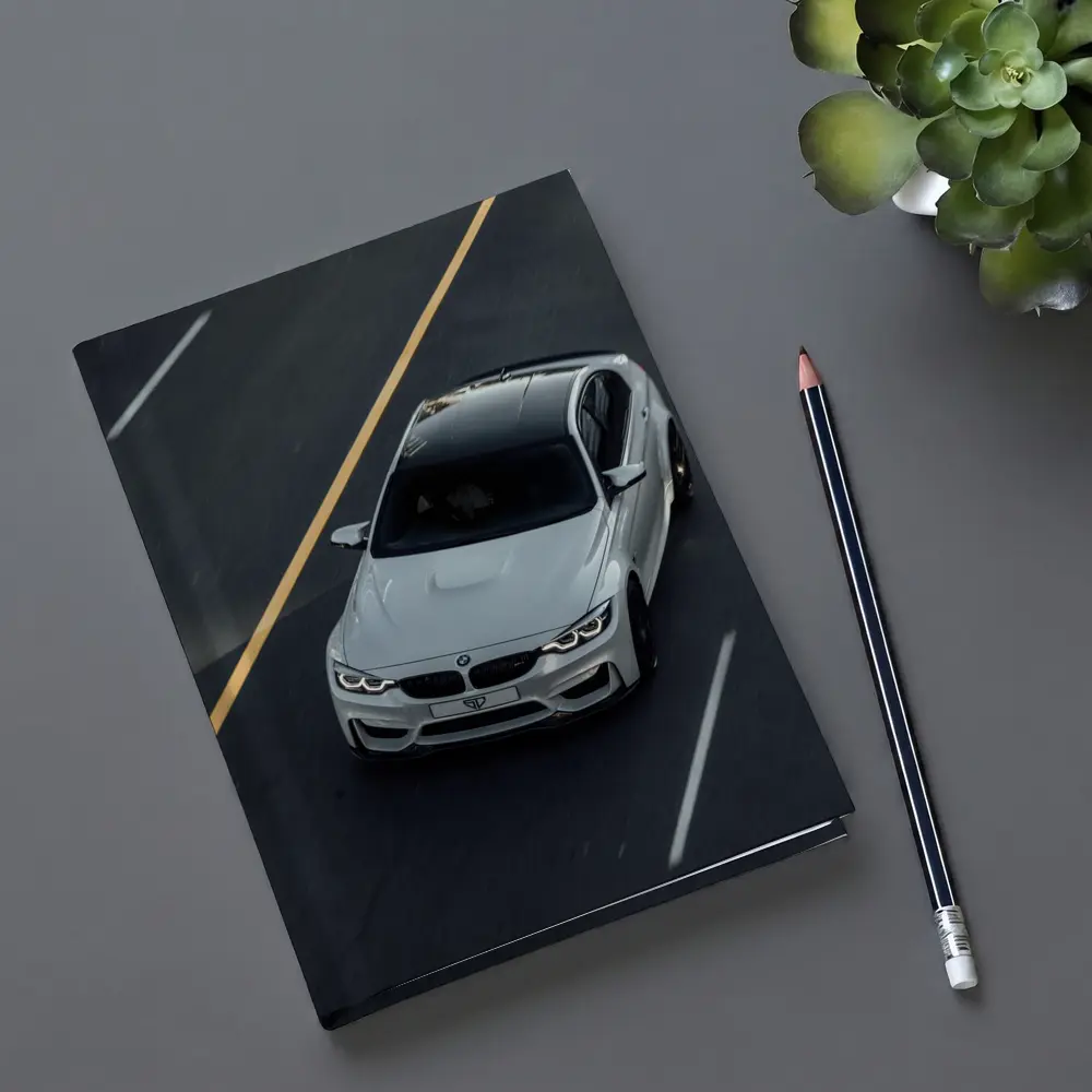 BMW M4 White Sedan on Open Road – Notebooks