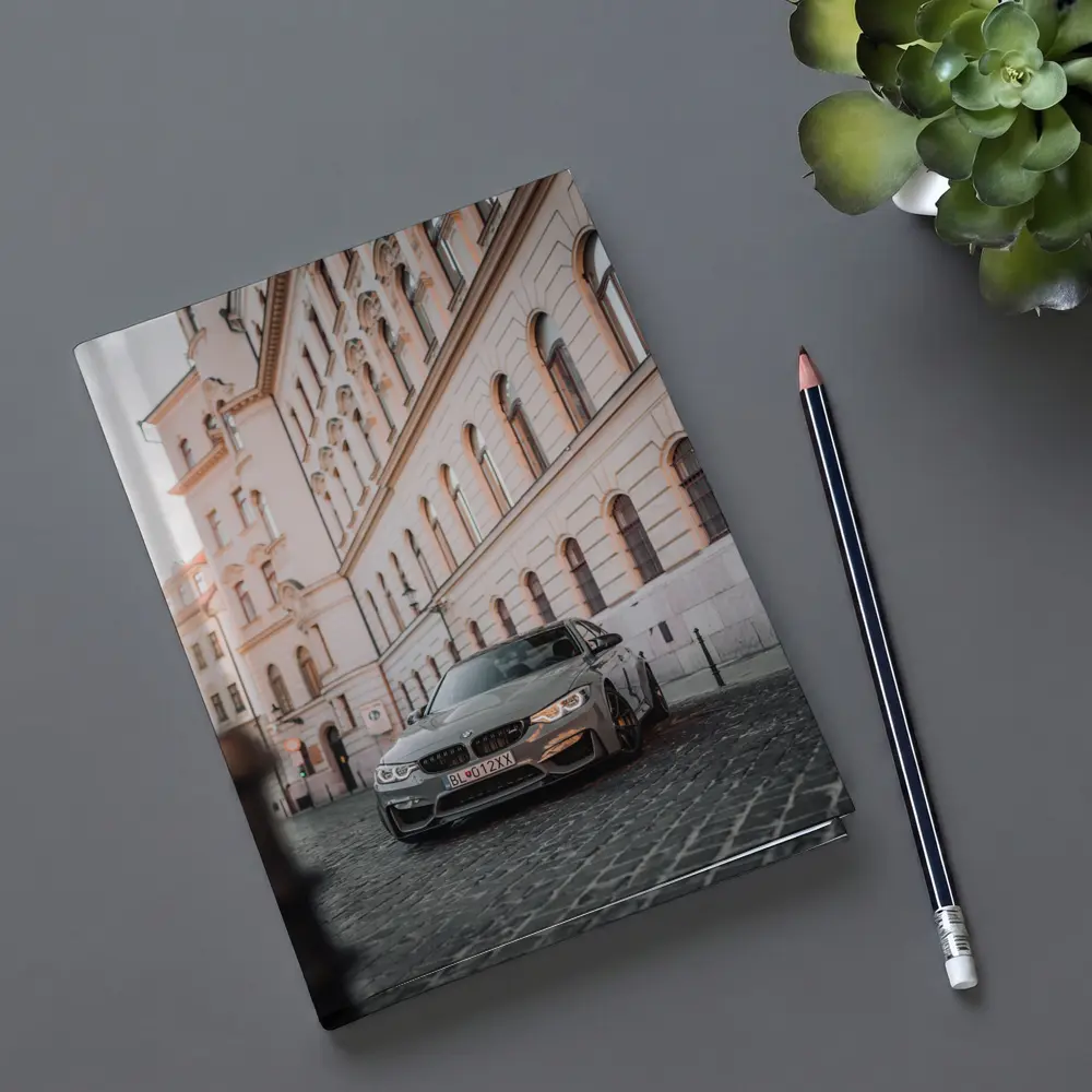 BMW M3 Gray Parked On Cobblestone Street – Notebooks
