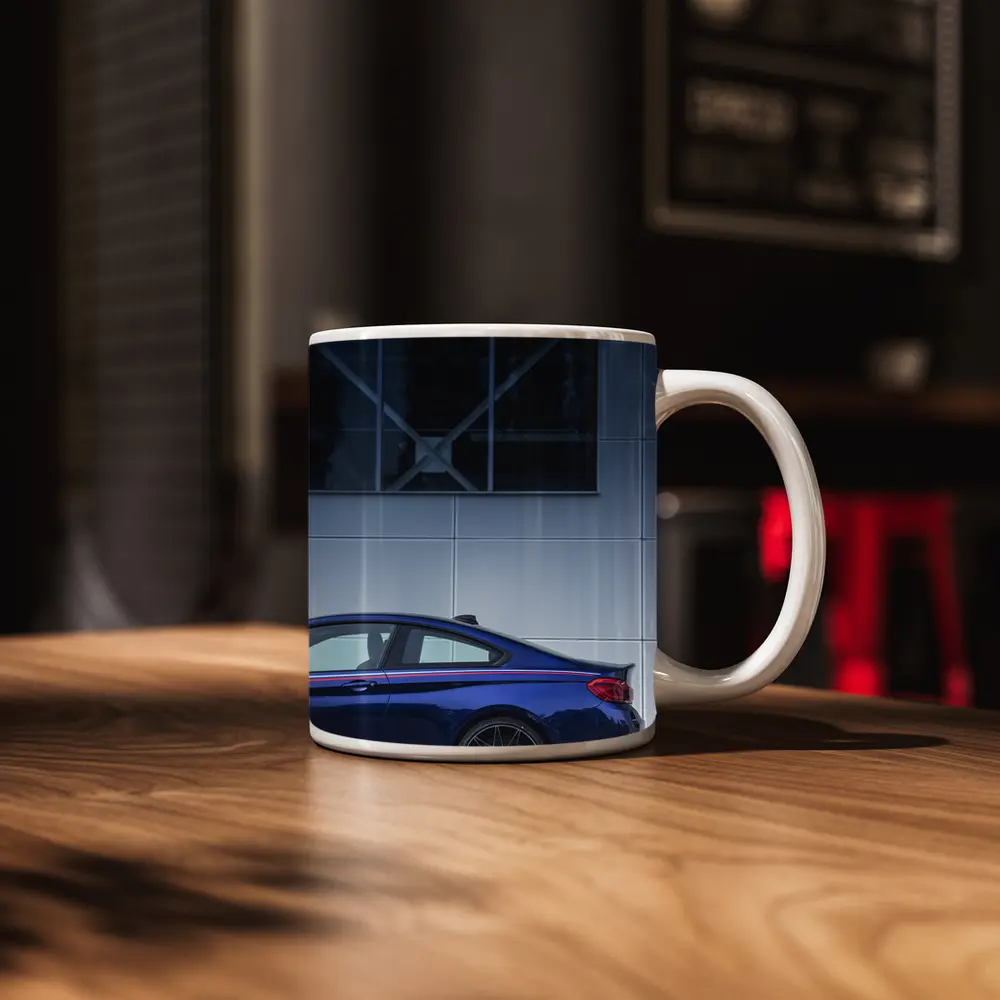 BMW M4 Blue Coupe Against Modern Building – Mugs