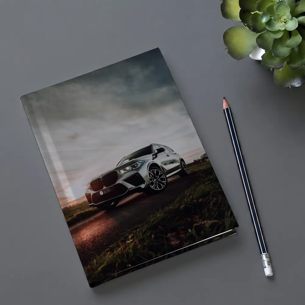 BMW X5M Silver SUV Dramatic Cloudy Sunset – Notebooks