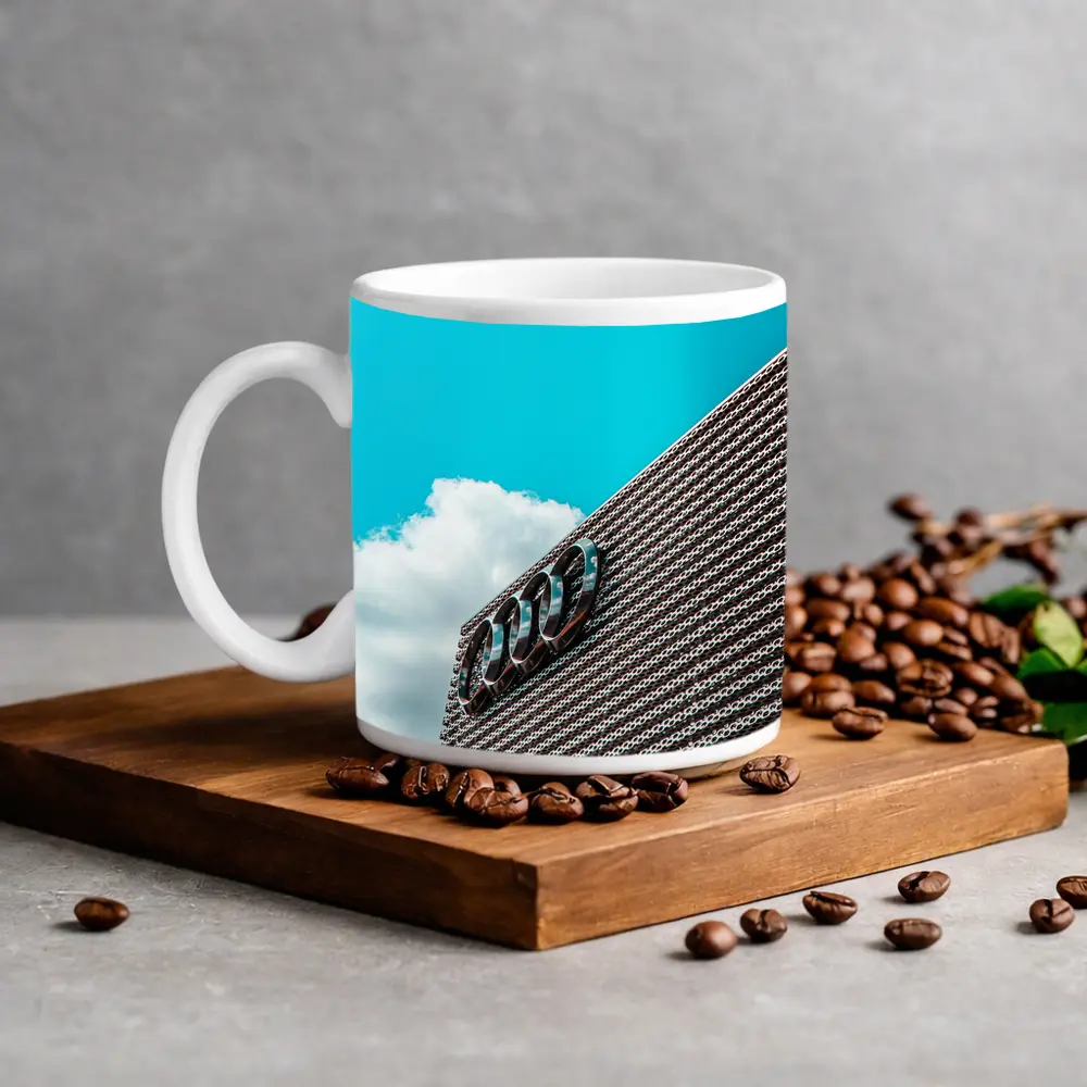 Audi Logo on Building Against Blue Sky – Mugs