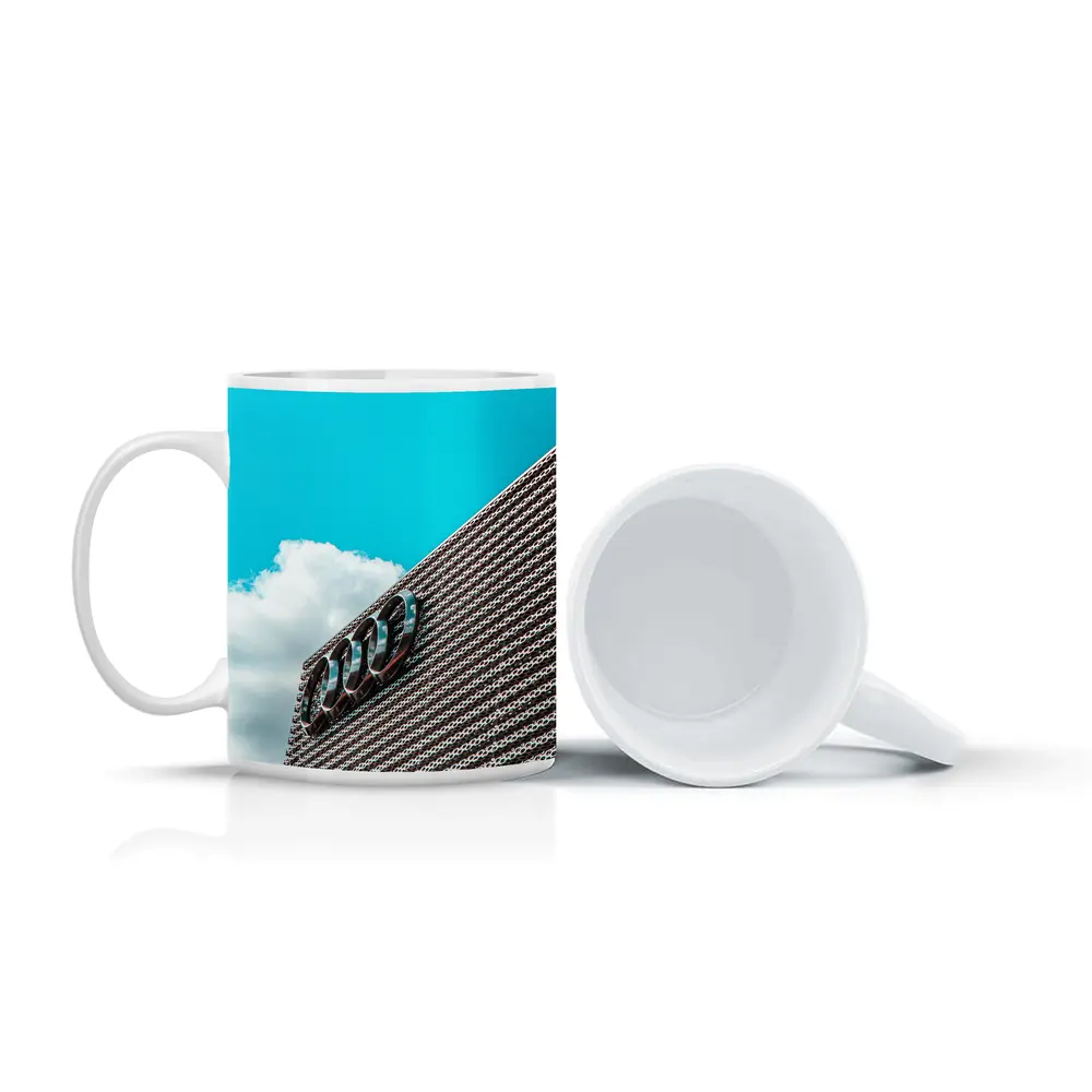 Audi Logo on Building Against Blue Sky – Mugs
