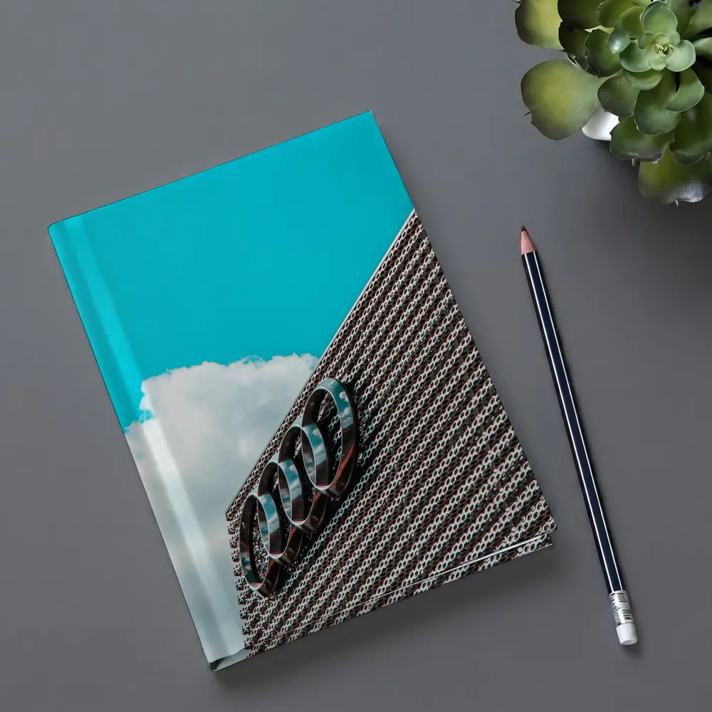 Audi Logo on Building Against Blue Sky – Notebooks