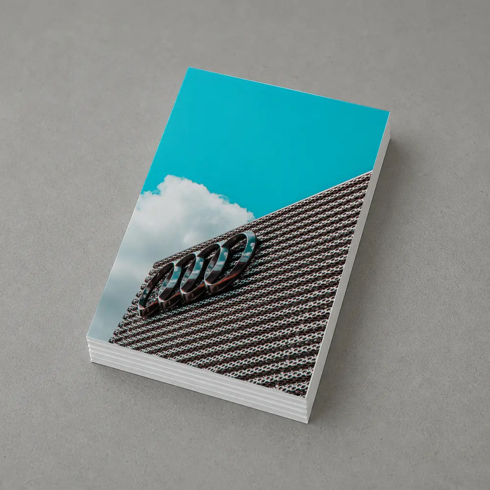 Audi Logo on Building Against Blue Sky – Postcards