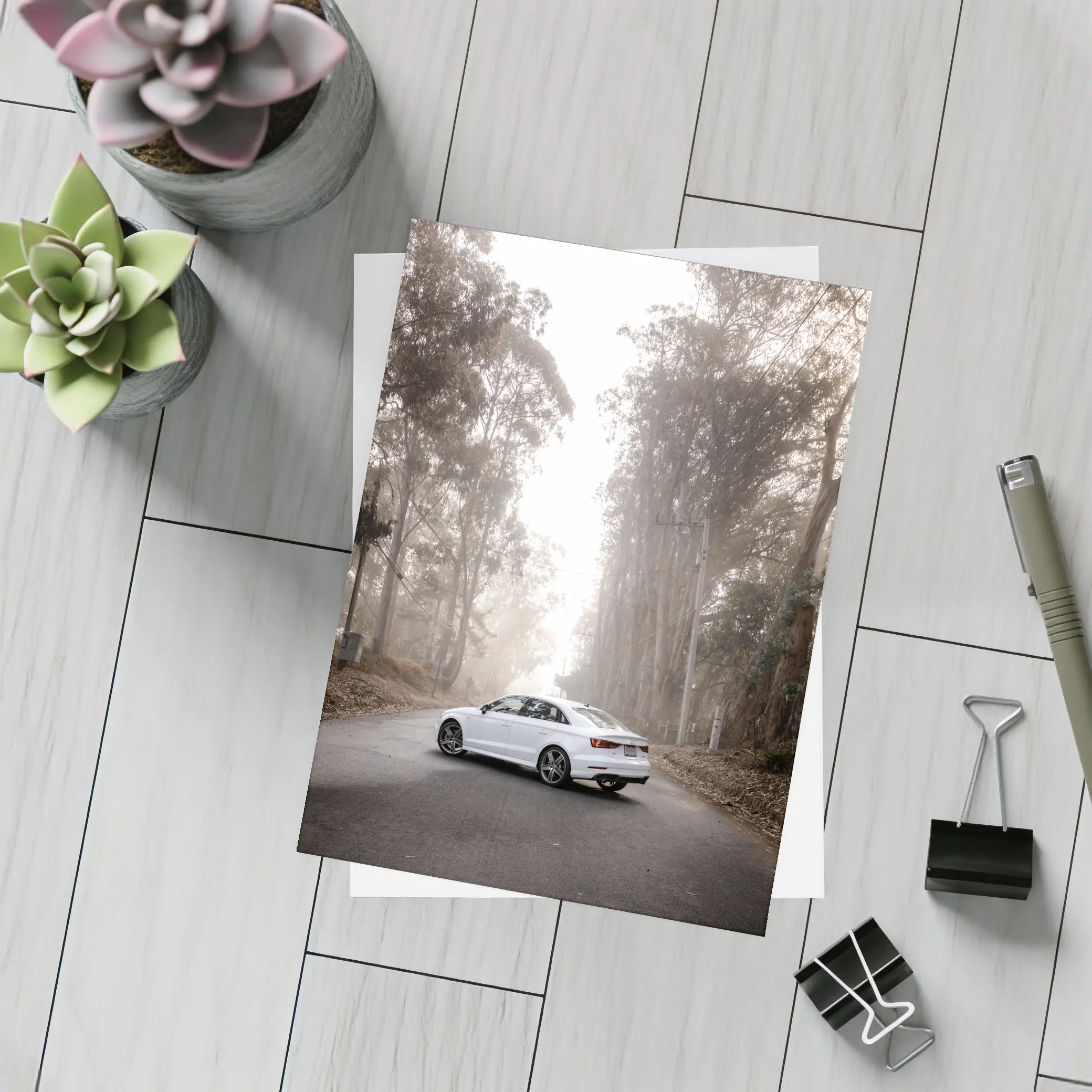 White Audi A3 on Misty Forest Road – Postcards