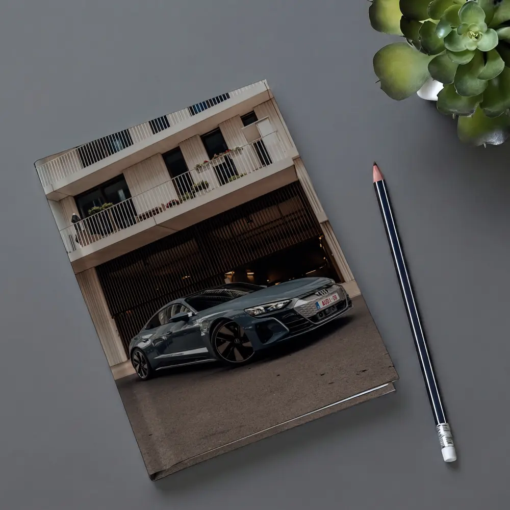 Audi E-Tron GT Parked Outside Modern Building – Notebooks