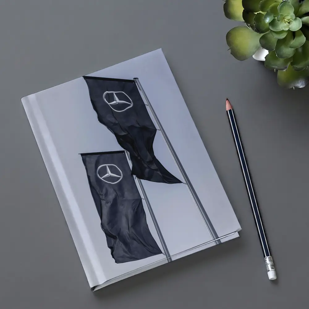 Mercedes Benz Flags Against Gray Sky – Notebooks