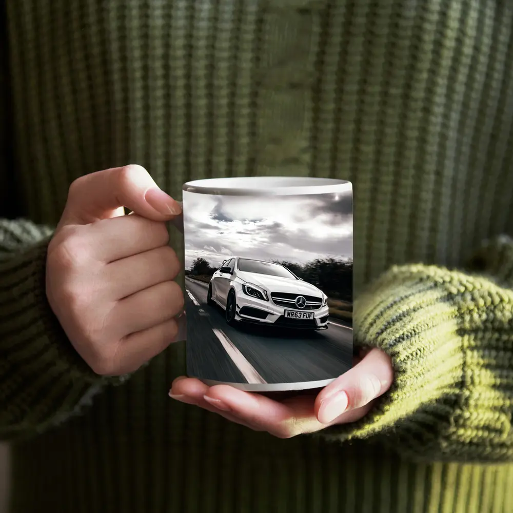Mercedes AMG White Hatchback On Open Road – Mugs