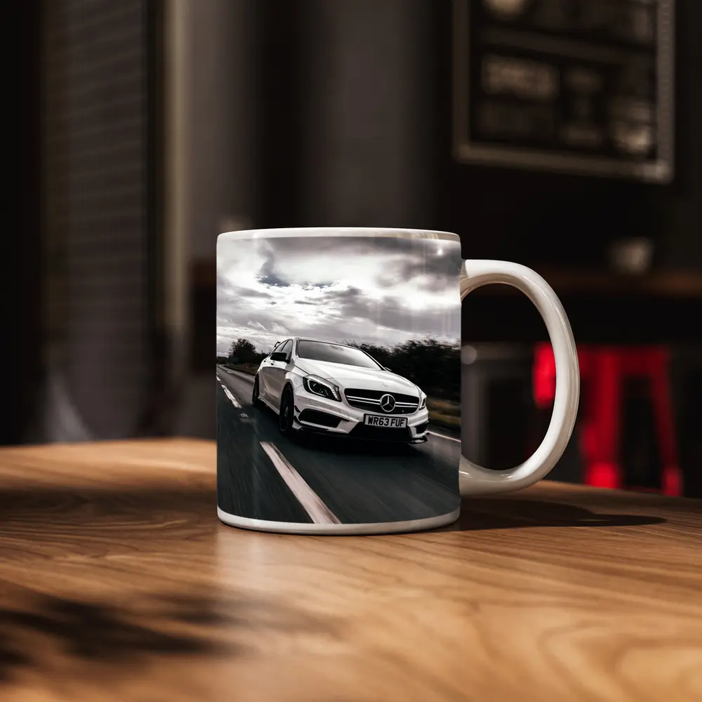 Mercedes AMG White Hatchback On Open Road – Mugs