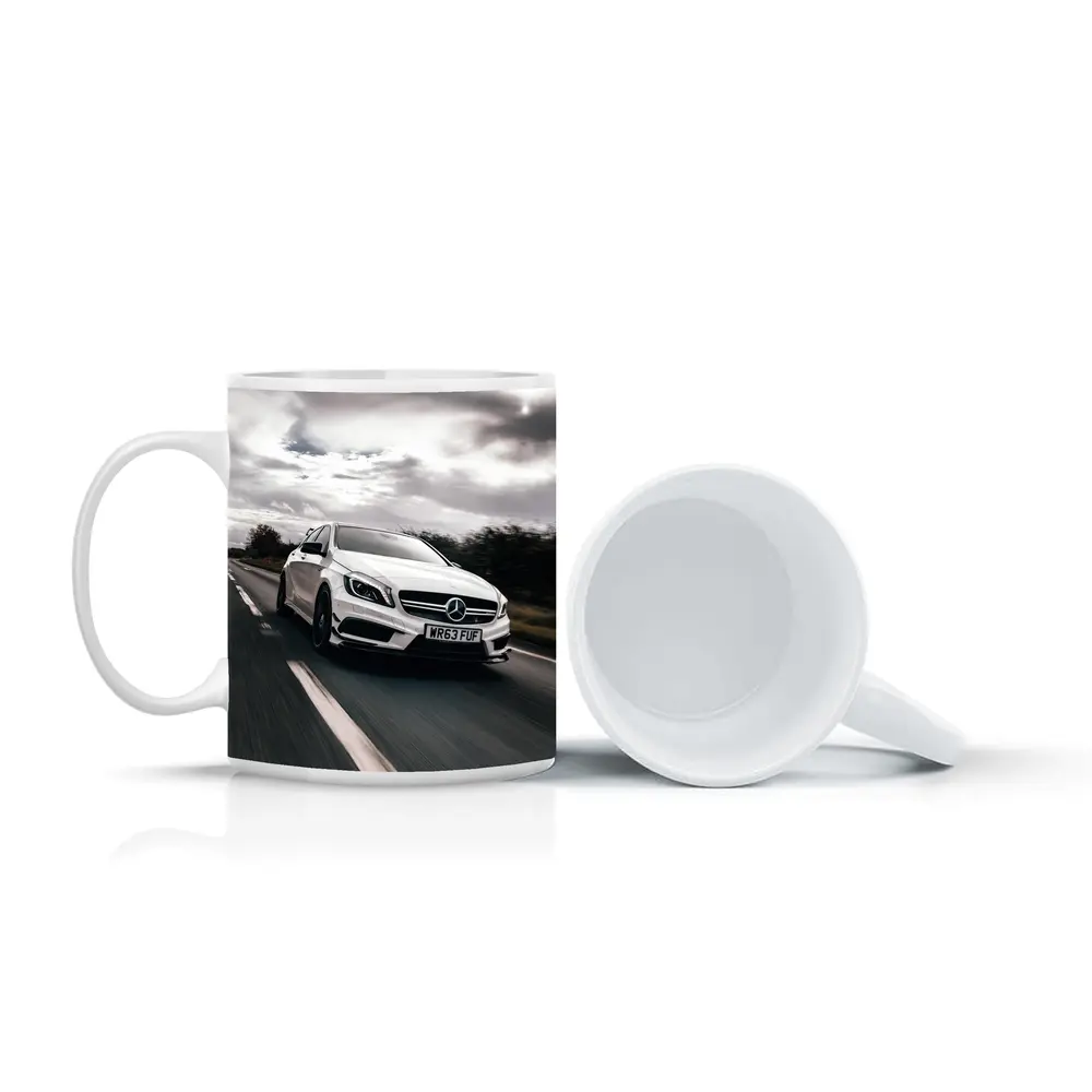 Mercedes AMG White Hatchback On Open Road – Mugs