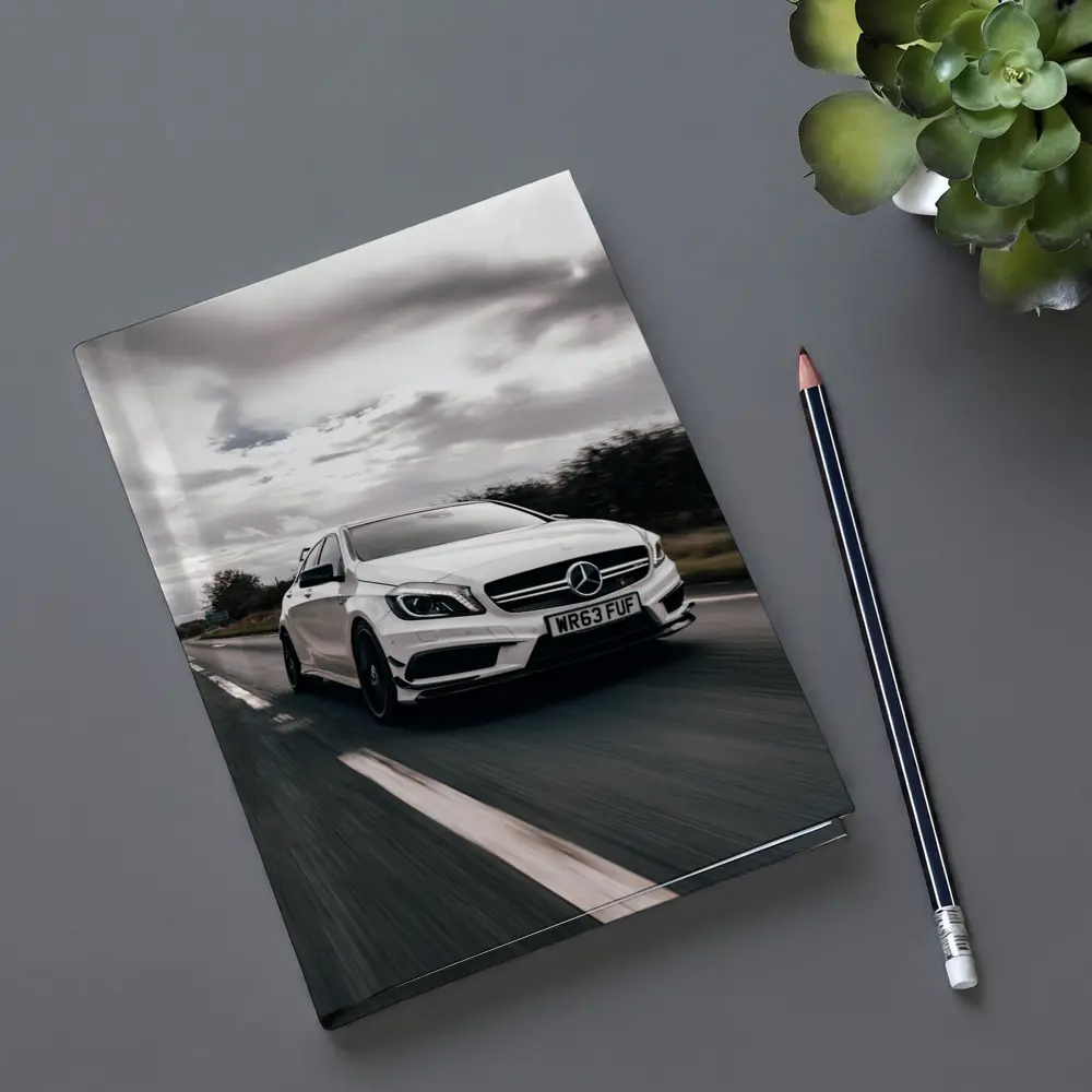Mercedes AMG White Hatchback On Open Road – Notebooks