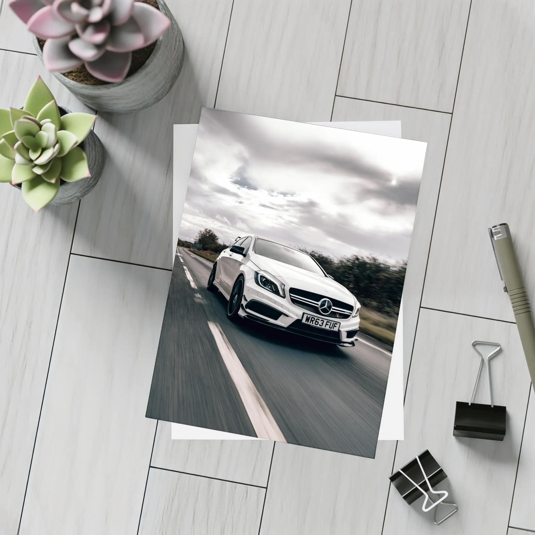 Mercedes AMG White Hatchback On Open Road – Postcards