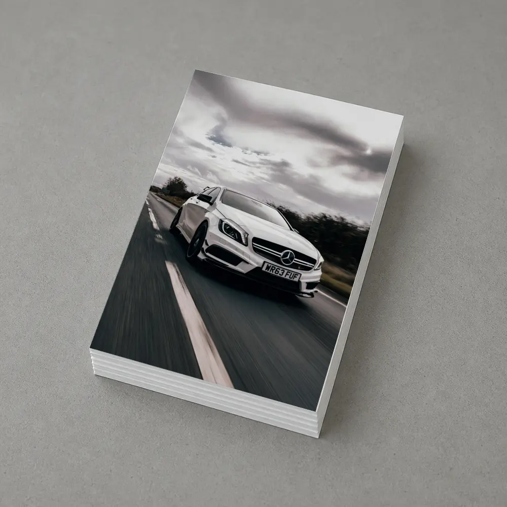 Mercedes AMG White Hatchback On Open Road – Postcards