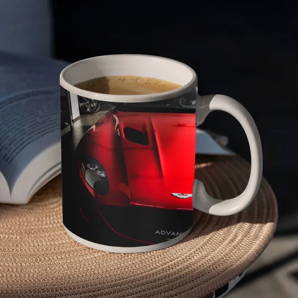 Red Aston Martin Vanquish Inside Dealership Showroom – Mugs