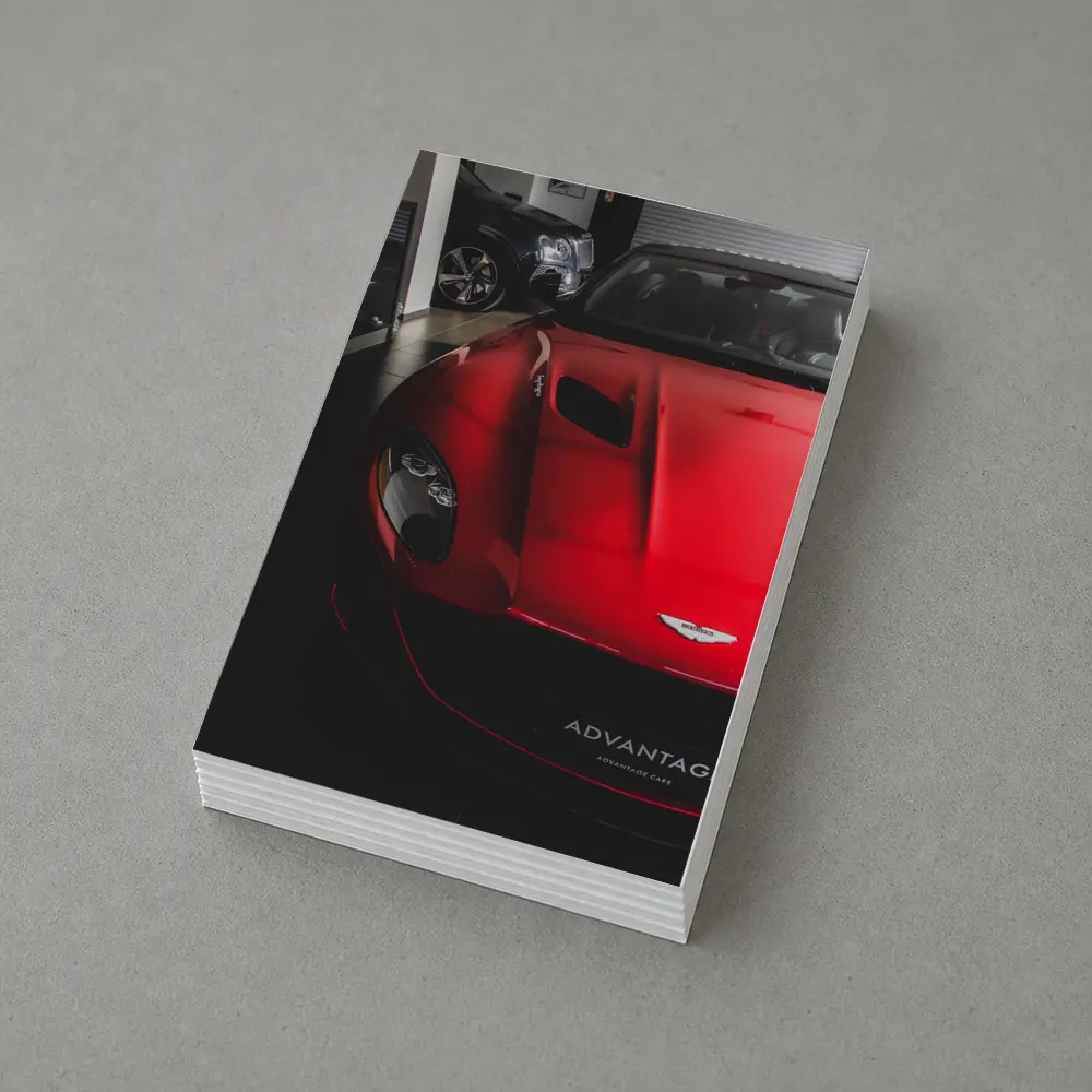 Red Aston Martin Vanquish Inside Dealership Showroom – Postcards