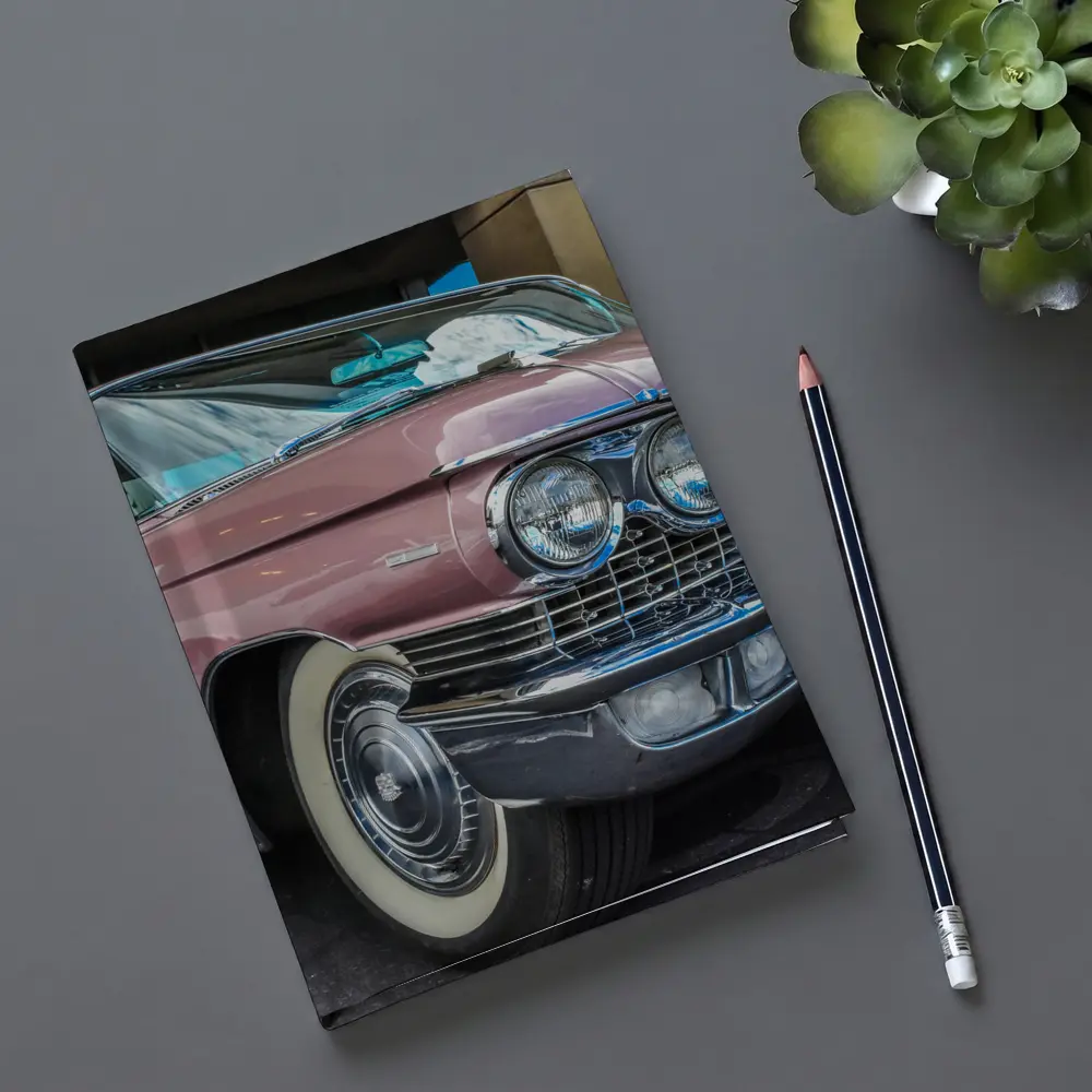 Classic Pink Cadillac Parked Outside Building – Notebooks