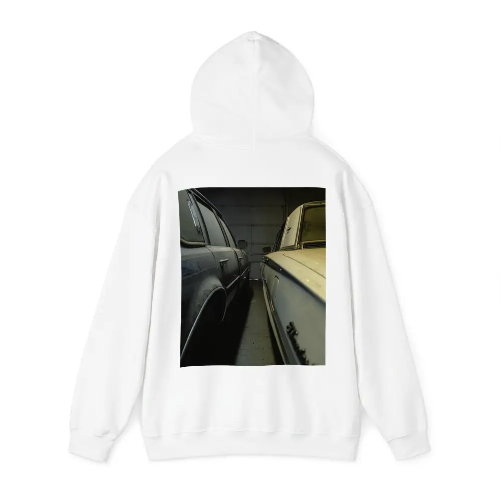 Two Classic Cars Parked Inside Dark Garage – Hoodies