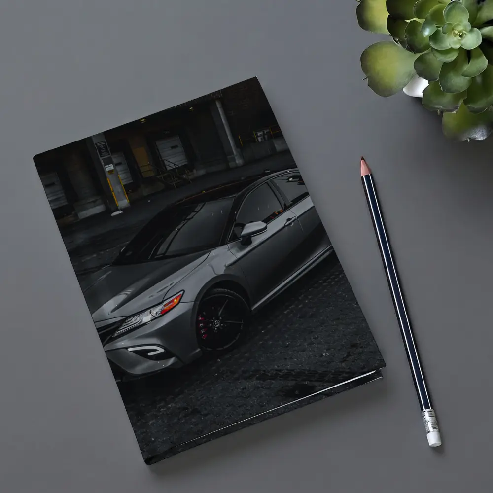 Toyota Camry Silver Sedan Dark Urban Setting – Notebooks