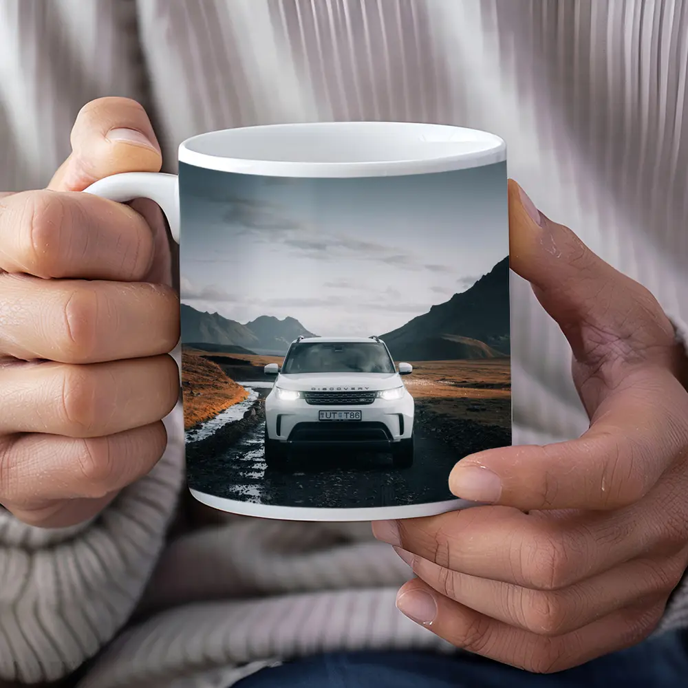Land Rover Discovery on Rugged Mountain Road – Mugs