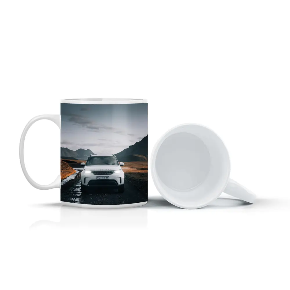 Land Rover Discovery on Rugged Mountain Road – Mugs