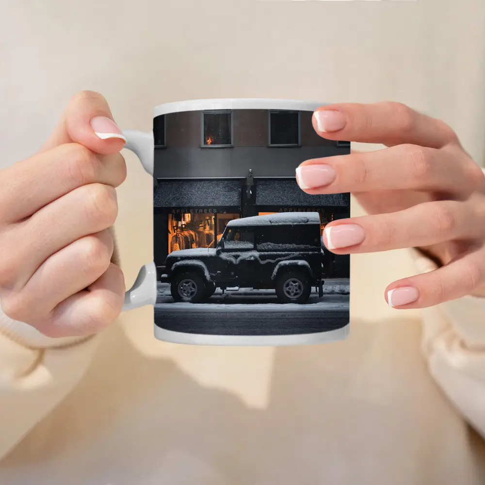 Land Rover Defender Snow Covered City Street – Mugs