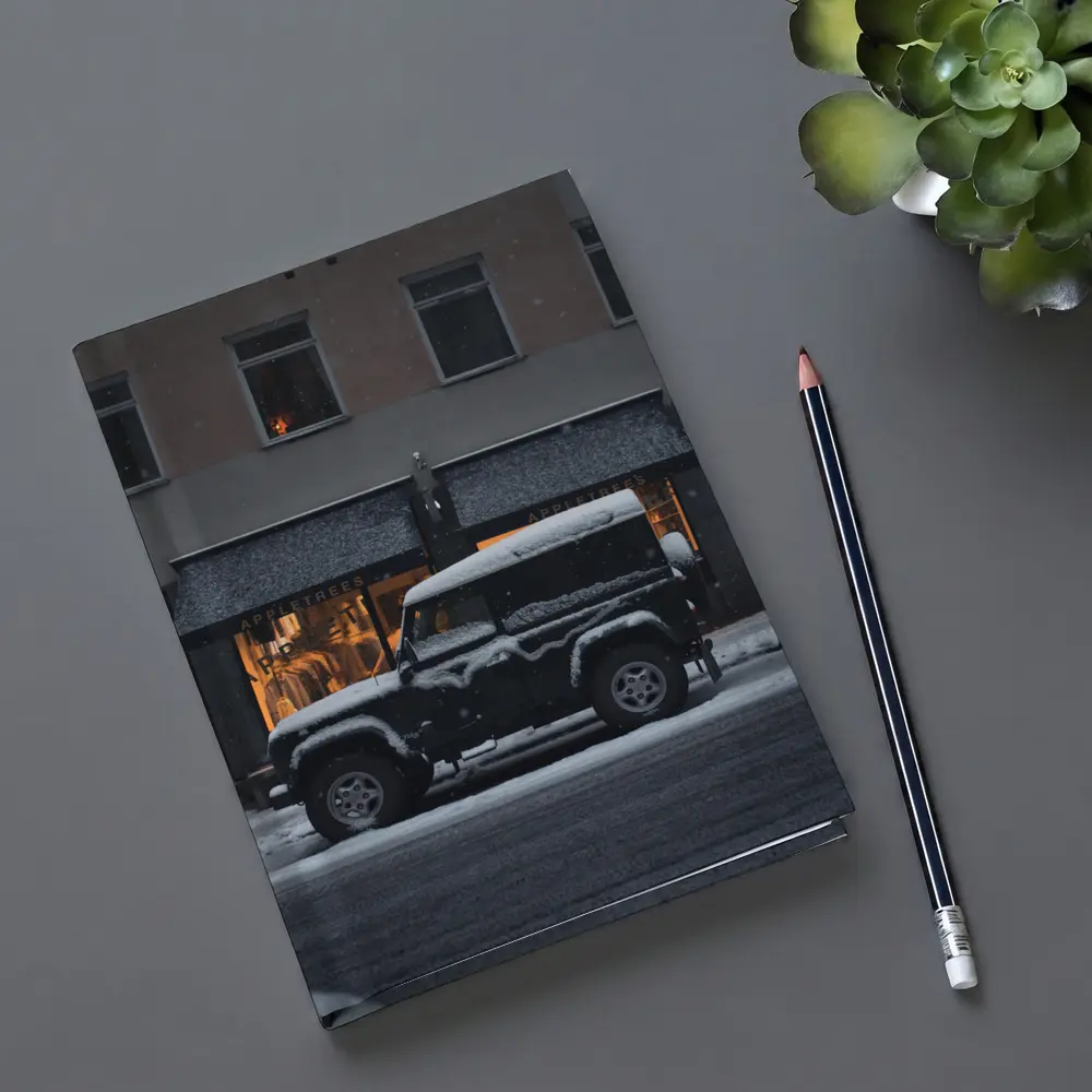 Land Rover Defender Snow Covered City Street – Notebooks