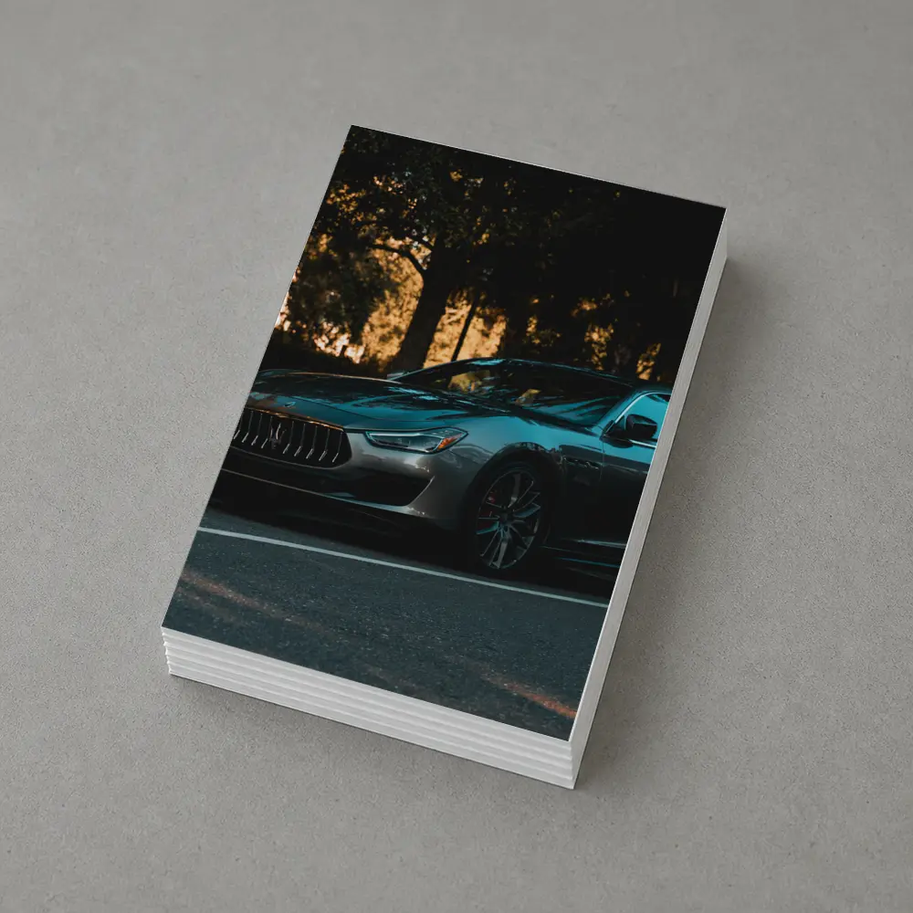 Maserati Ghibli Parked Under Evening Trees – Postcards