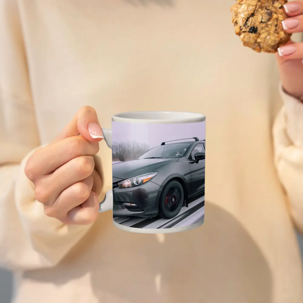 Mazda 3 Hatchback Racing Through Winter Snow – Mugs