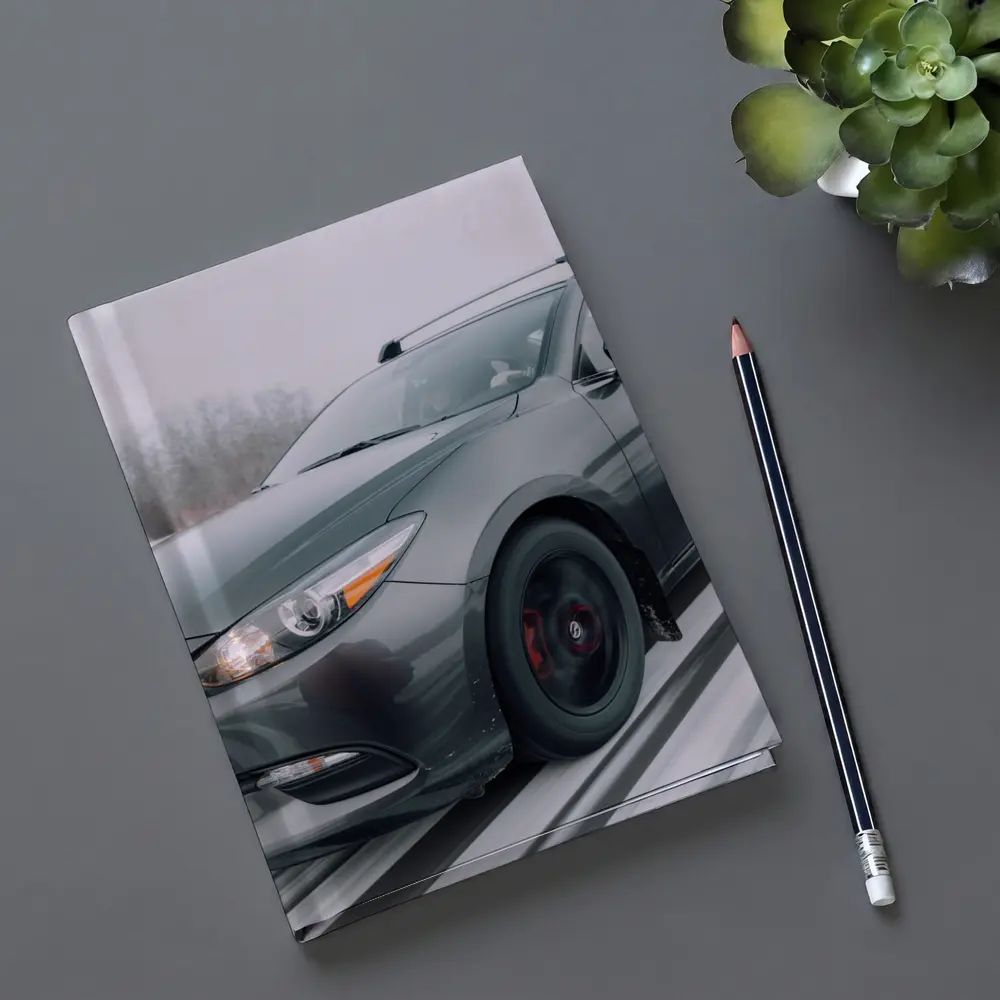 Mazda 3 Hatchback Racing Through Winter Snow – Notebooks