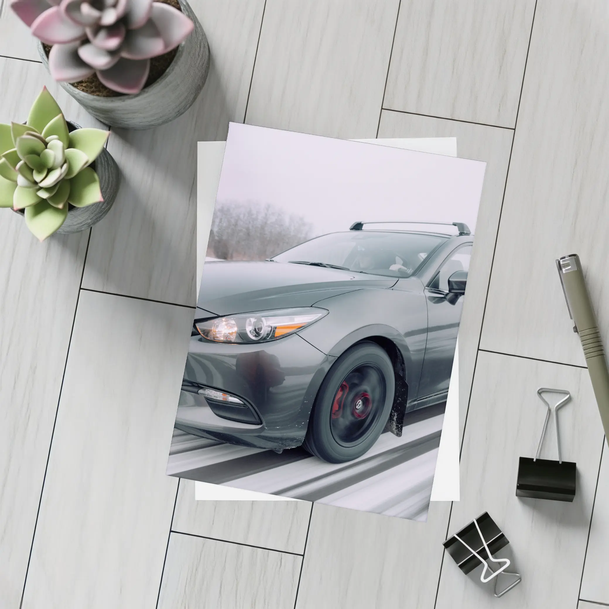 Mazda 3 Hatchback Racing Through Winter Snow – Postcards