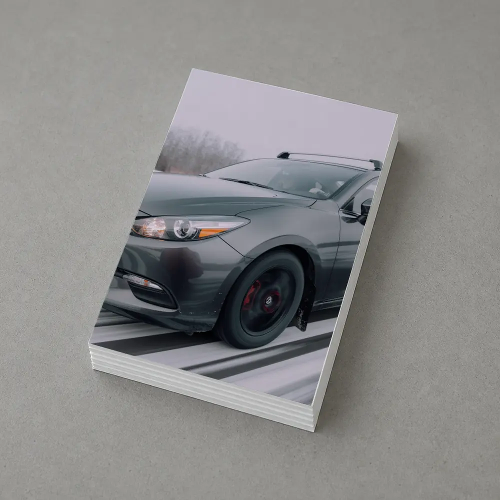 Mazda 3 Hatchback Racing Through Winter Snow – Postcards