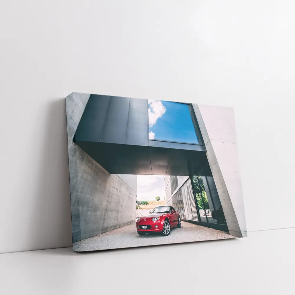 Red Mazda MX-5 Parked Under Modern Architecture – Wall Art