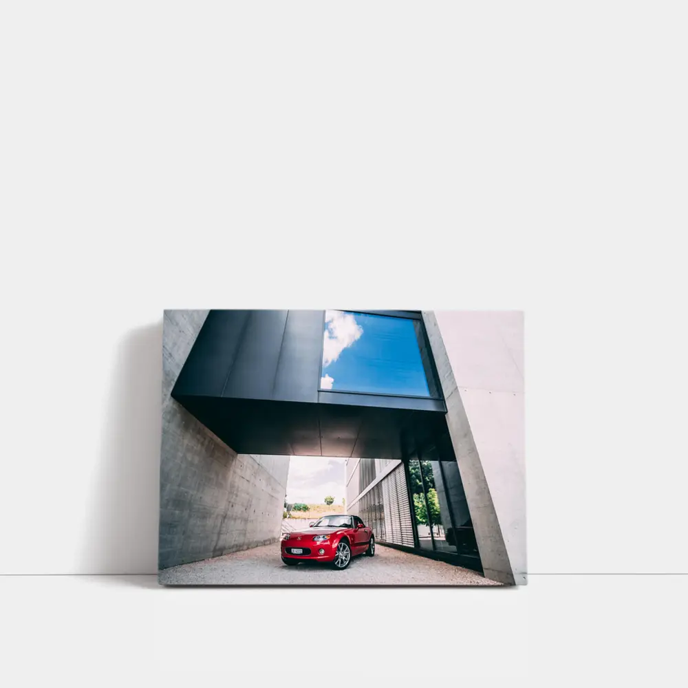 Red Mazda MX-5 Parked Under Modern Architecture – Wall Art