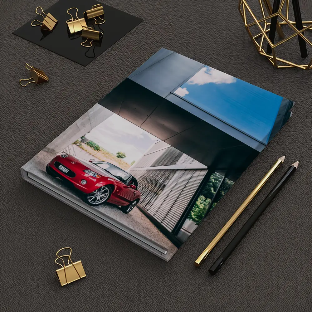Red Mazda MX5 Parked Under Modern Architecture – Notebooks