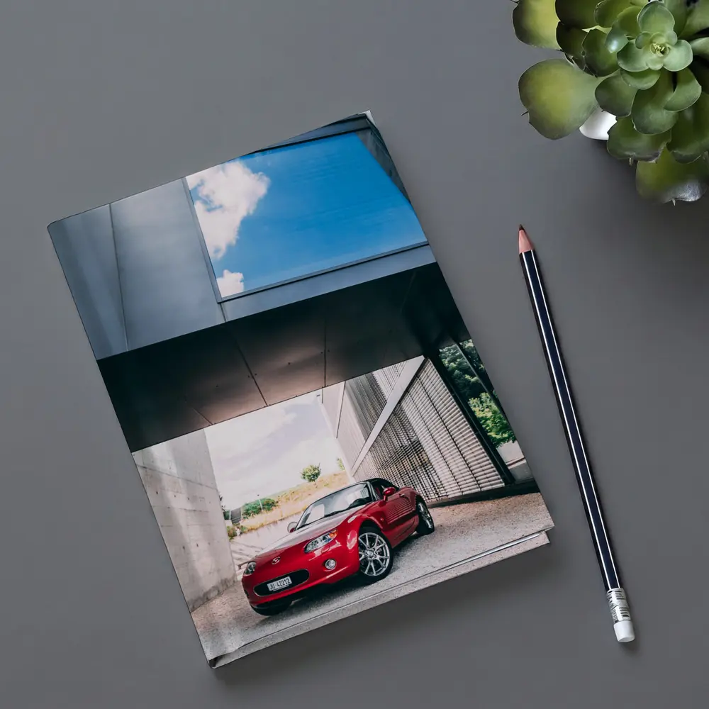 Red Mazda MX5 Parked Under Modern Architecture – Notebooks