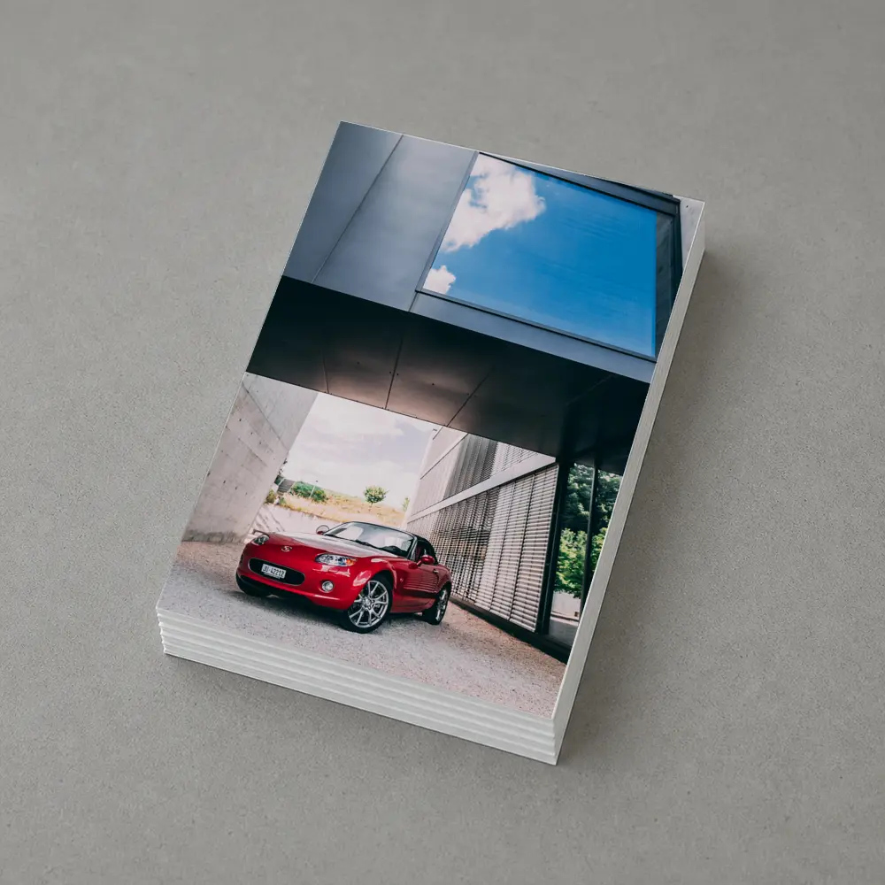 Red Mazda MX5 Parked Under Modern Architecture – Postcards