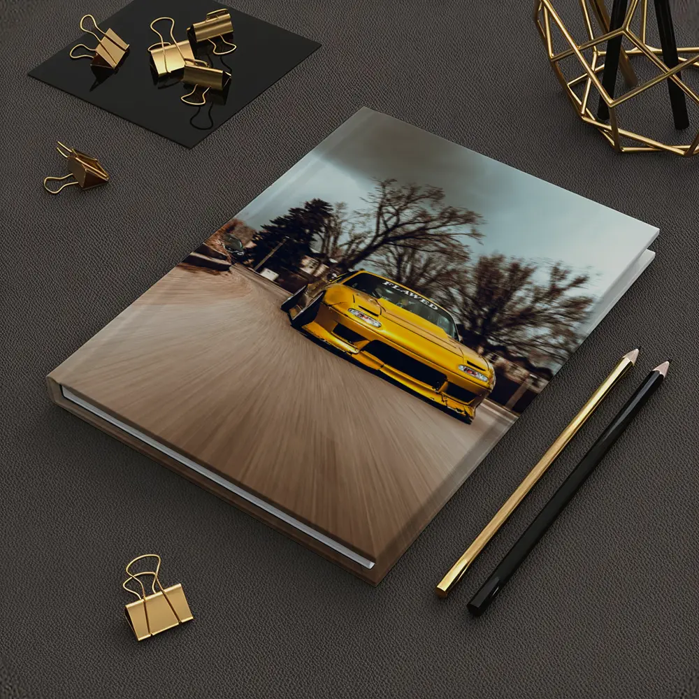 Yellow Mazda RX-7 Racing Through City Street – Notebooks