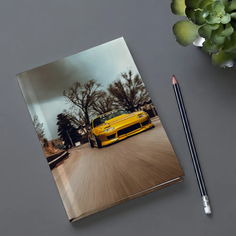 Yellow Mazda RX-7 Racing Through City Street – Notebooks