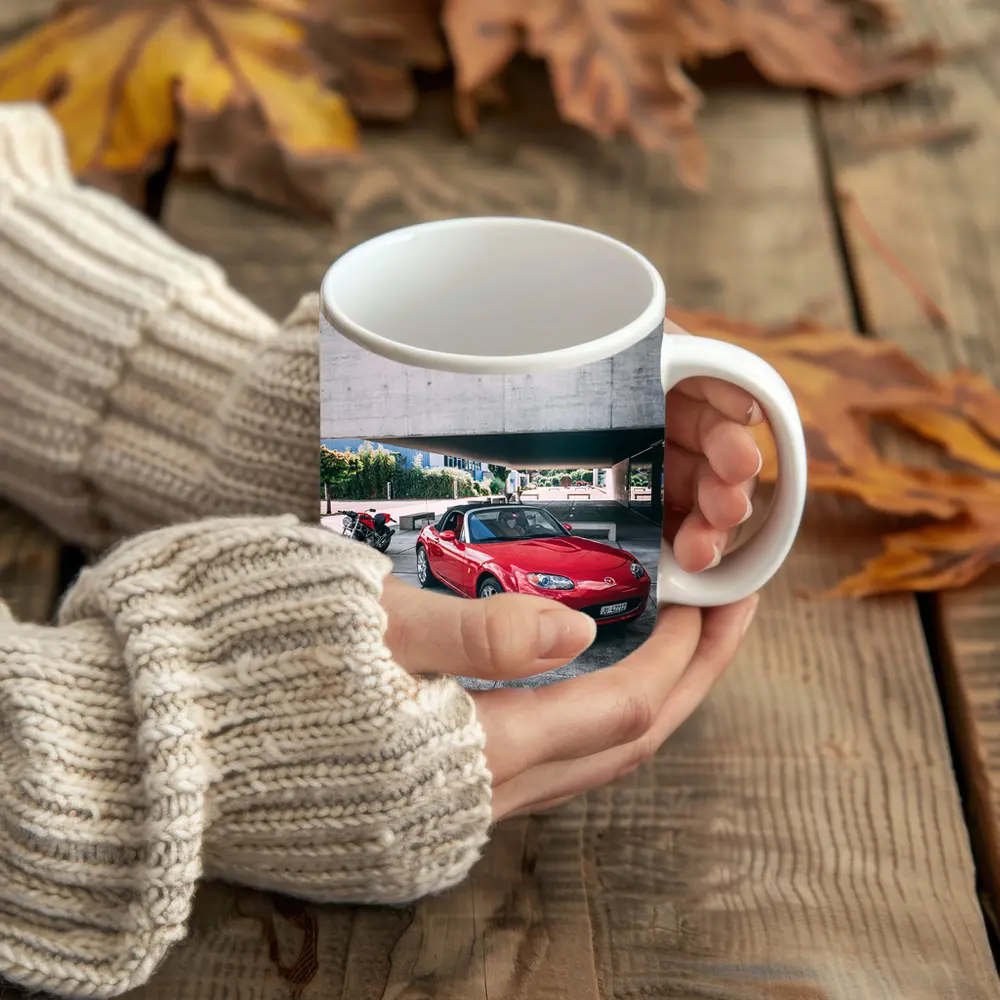 Red Mazda MX5 Parked Near Concrete Structure – Mugs