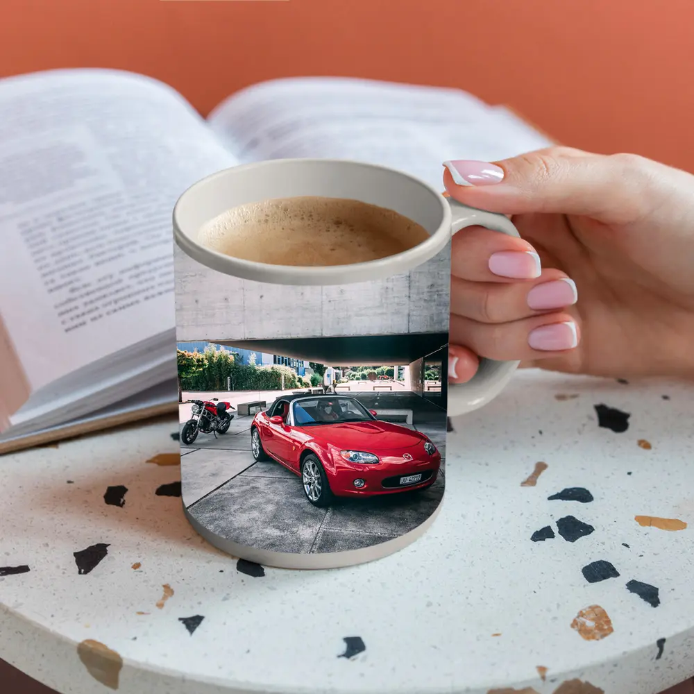 Red Mazda MX5 Parked Near Concrete Structure – Mugs