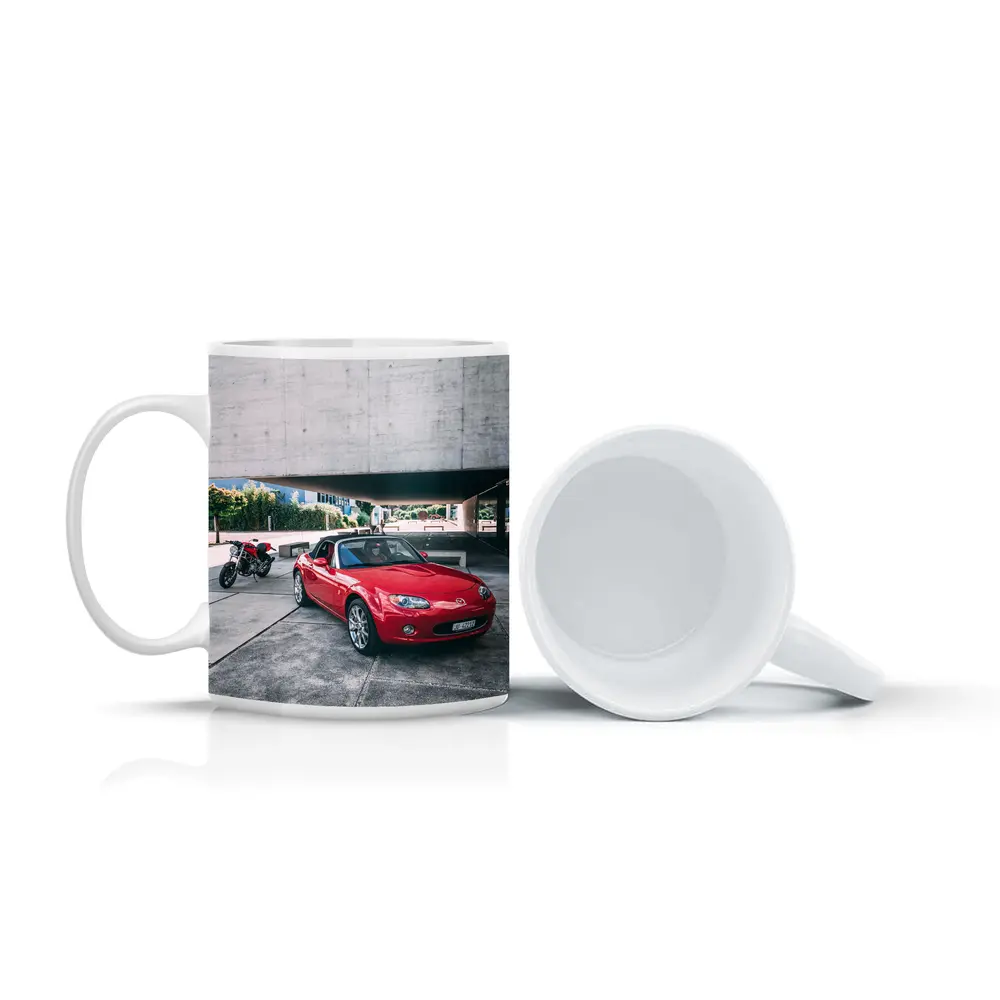 Red Mazda MX5 Parked Near Concrete Structure – Mugs
