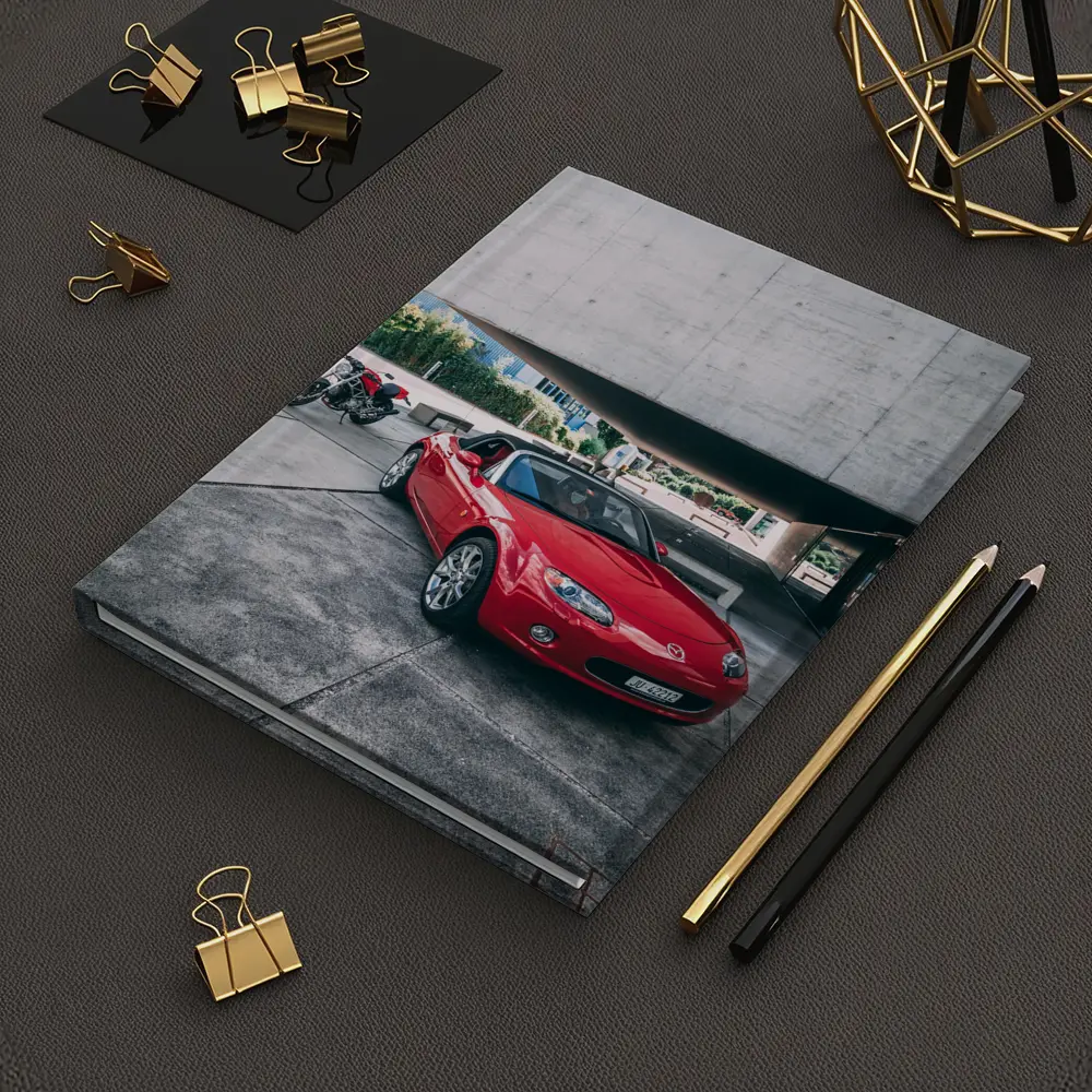 Red Mazda MX5 Parked Near Concrete Structure – Notebooks