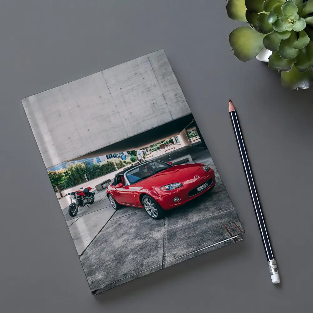 Red Mazda MX5 Parked Near Concrete Structure – Notebooks