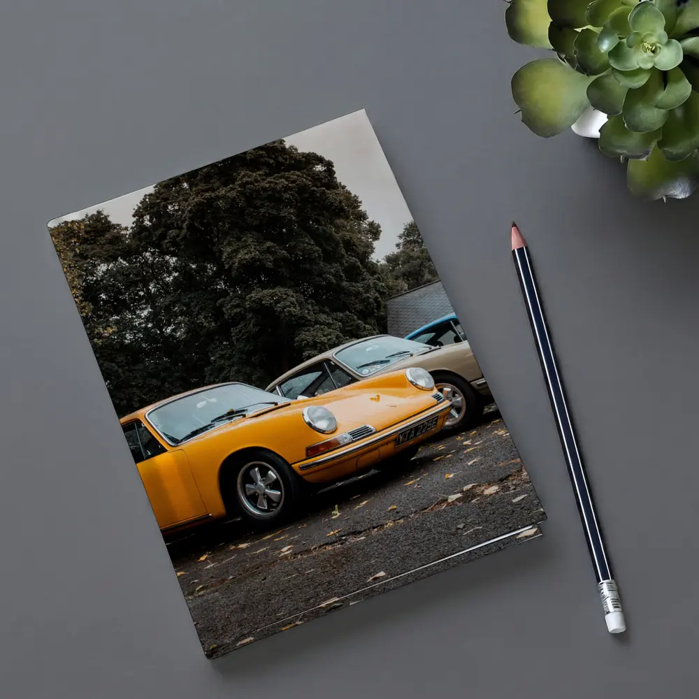 Classic Porsche 911 Trio Parked Outdoors – Notebooks