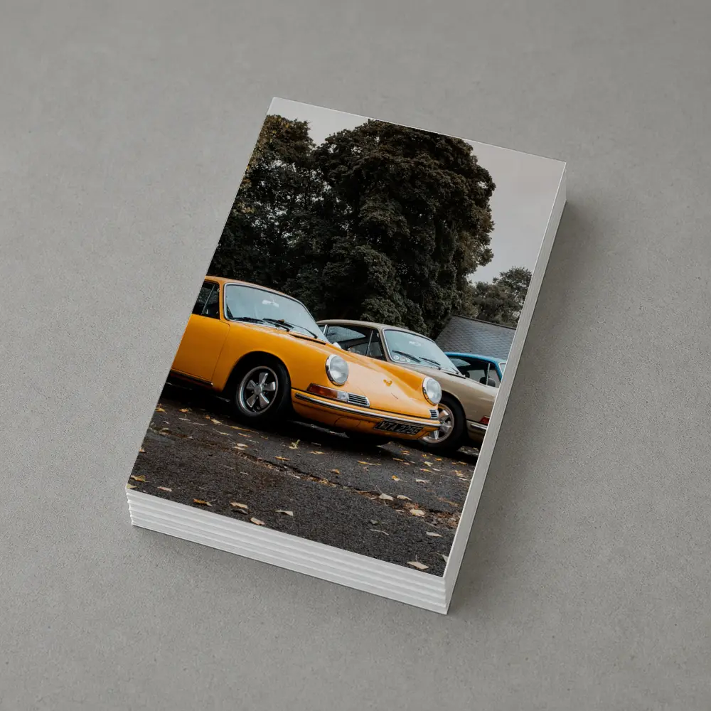 Classic Porsche 911 Trio Parked Outdoors – Postcards