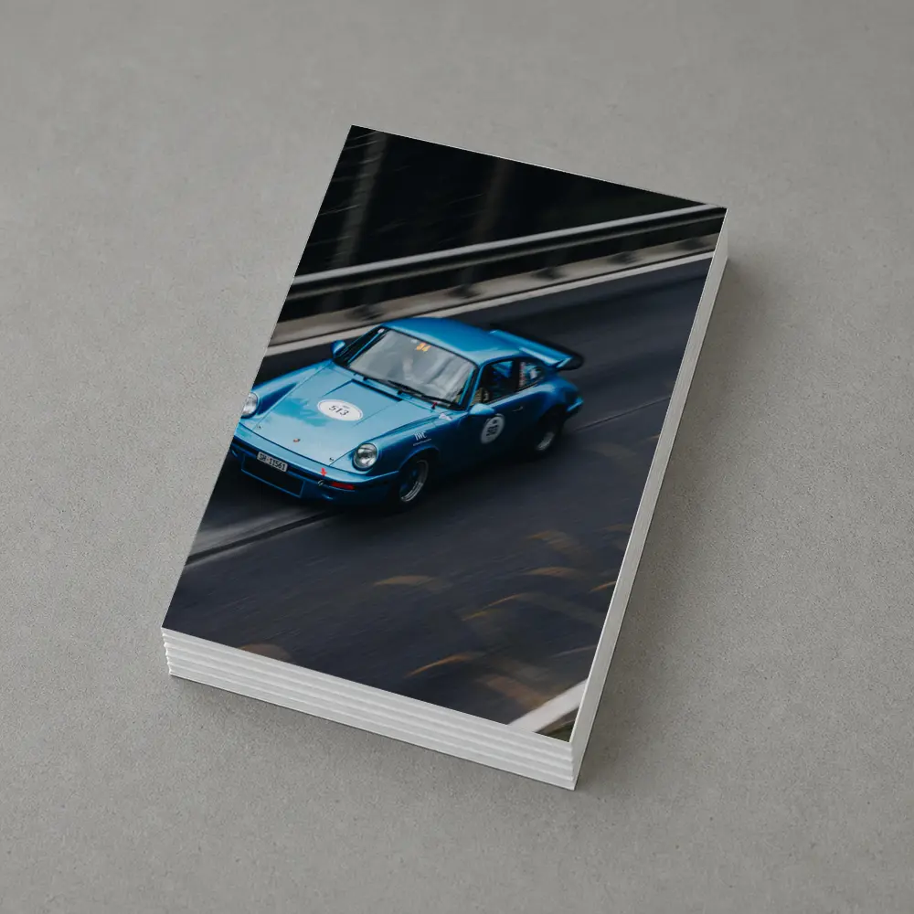 Blue Porsche 911 Racing on Mountain Road – Postcards