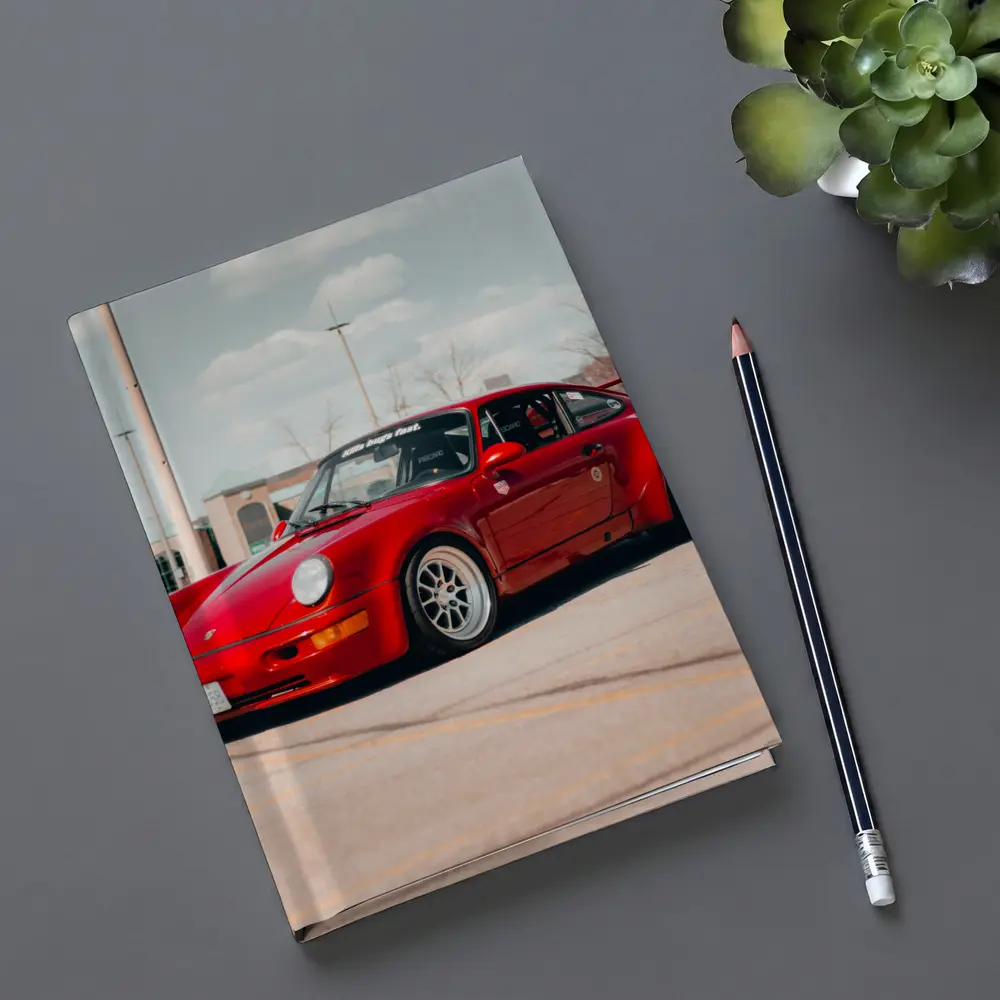 Red Porsche 911 Parked Open Lot – Notebooks