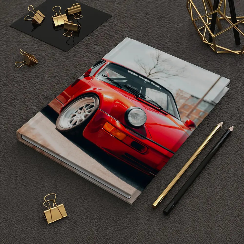 Red Porsche 911 Parked on Urban Street – Notebooks