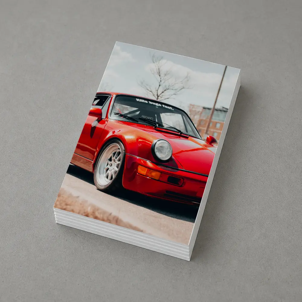 Red Porsche 911 Parked on Urban Street – Postcards