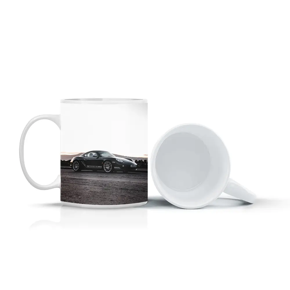 Black Porsche Cayman Parked on Rugged Terrain – Mugs